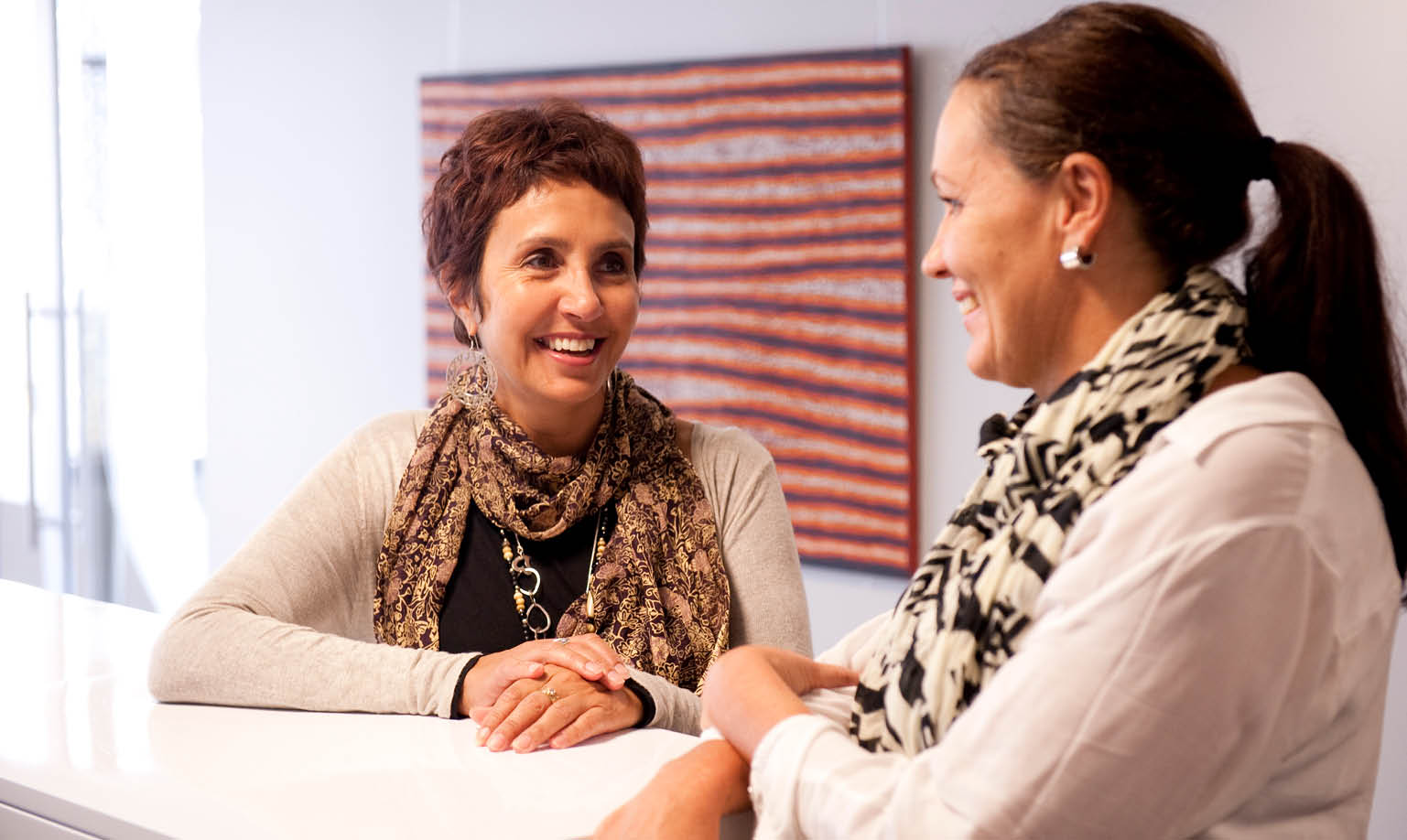 Photograph of two women conversing