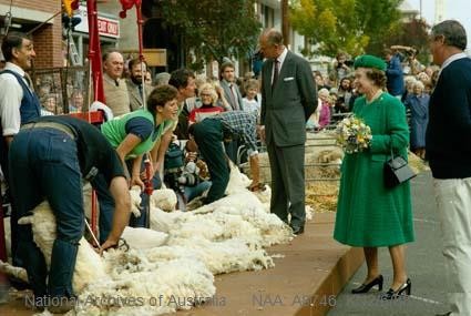 Her Majesty The Queen and The Duke of Edinburgh watch sheep shearing on a Victorian street