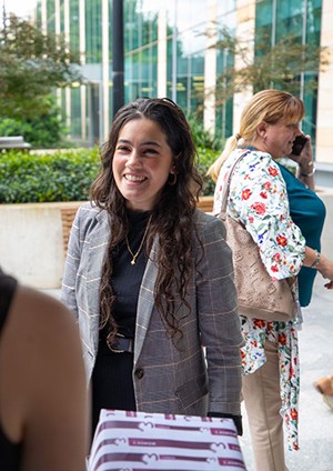 Young person smiling to another person