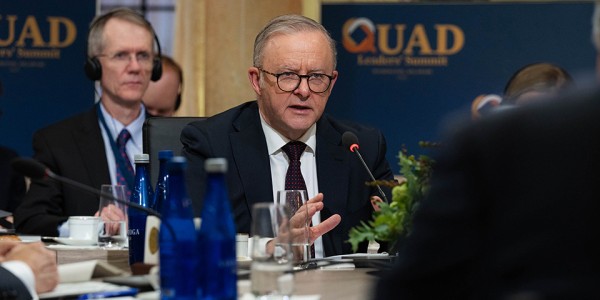 Prime Minister Anthony Albanese seated in front of a microphone at the 2024 Quad Leaders’ Summit.