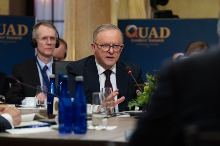 Prime Minister Anthony Albanese seated in front of a microphone at the 2024 Quad Leaders’ Summit.