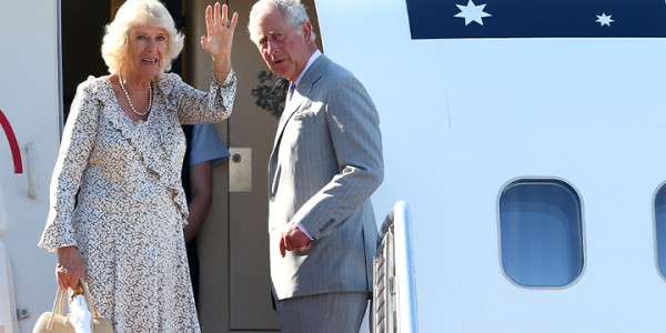 Charles, Prince of Wales and Camilla, Duchess of Cornwall waving farewell while boarding a Royal Australian Airforce aircraft.