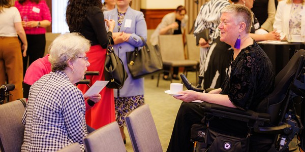 Elizabeth Reid AO and Christina Ryan chat informally an event celebrating the Office for Women’s 50th anniversary.