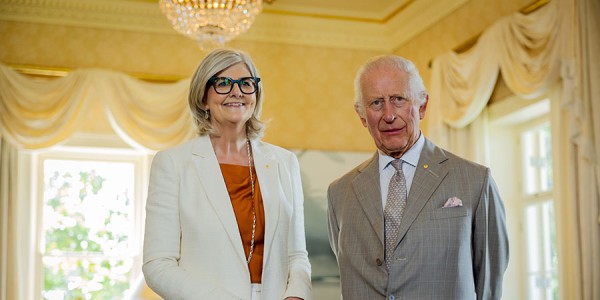 His Majesty and Her Excellency the Hon Sam Mostyn AC stand posing for the camera.